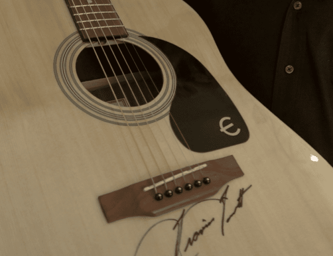 Cody Johnson, Zach Top, Ronnie Dunn, Travis Tritt, Riley Green & More Sign Guitars To Support Wounded Officers Working California Wildfires