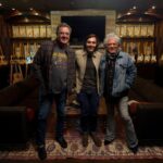 Musicians standing together in a recording studio for Vince Gill’s Marty And Me project.